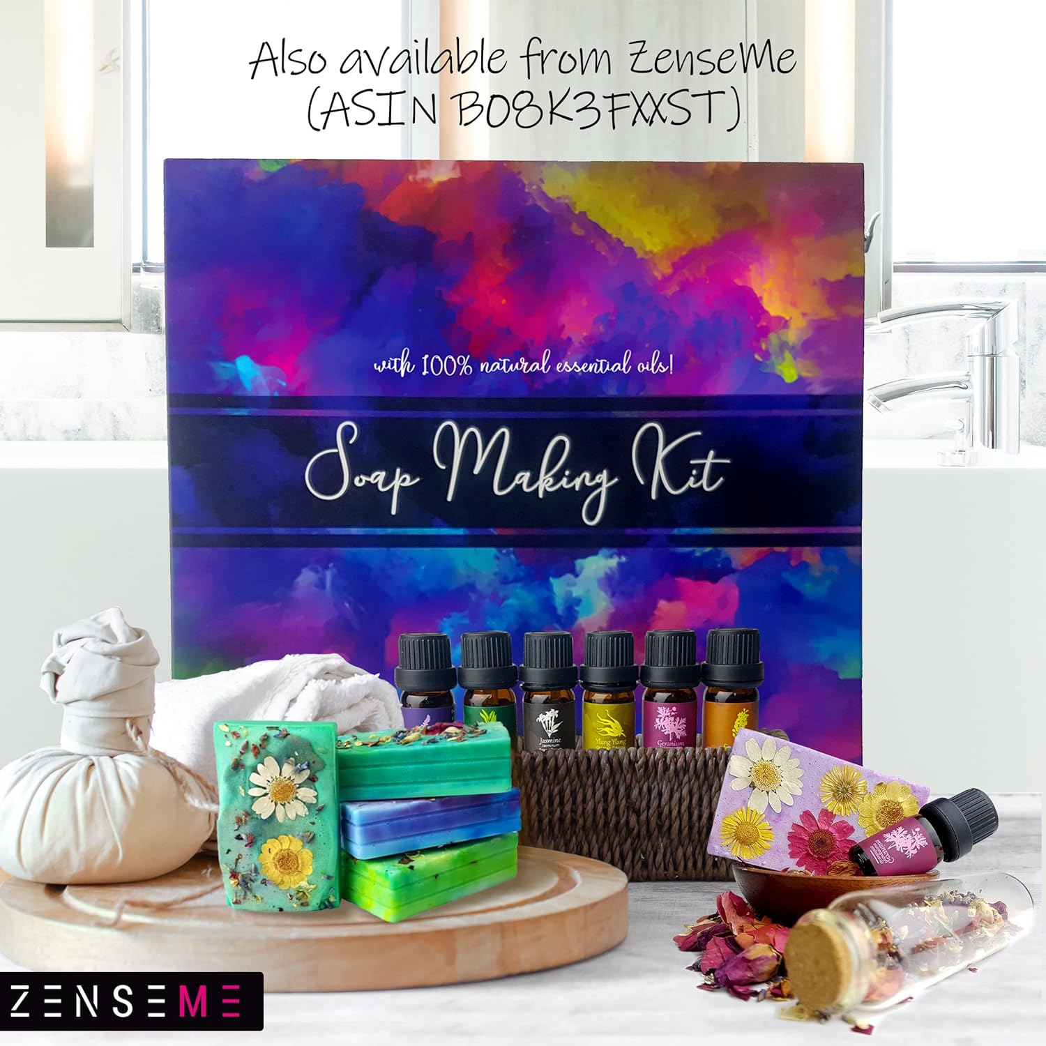 Soap making kit with colorful packaging, soap bars, and essential oils on a white surface.